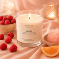 Juliet romantic soy candle by Soulful Sage, lit with a full melt pool, styled with raspberries, spun sugar, rose petals, and soft candlelight.