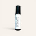 Soulful Sage Nourish + Define Brow Conditioning Oil roller bottle with a white label and black cap, shown on a soft neutral background.