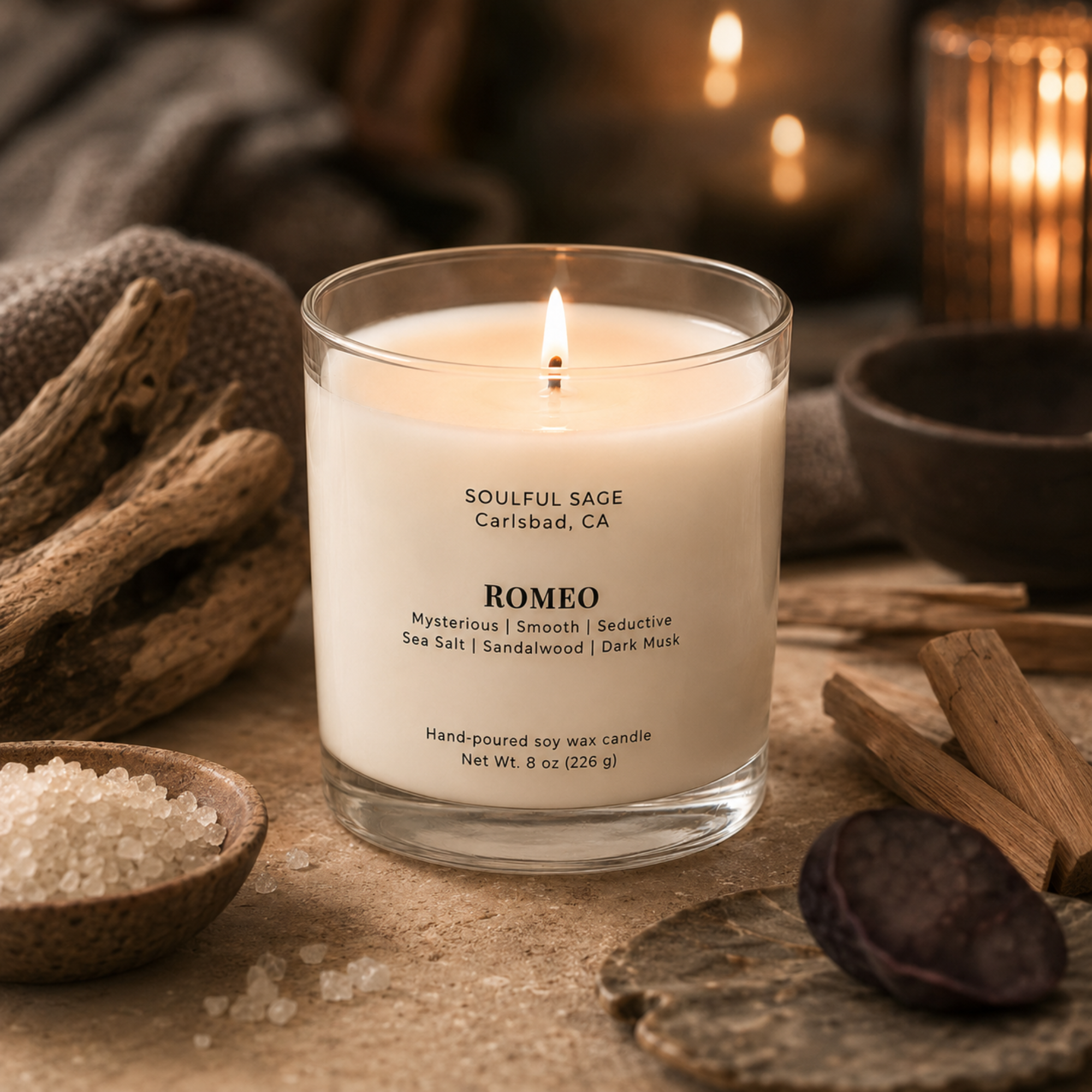 Romeo soy candle by Soulful Sage, lit with a full melt pool and styled with sea salt crystals, sandalwood, driftwood, and warm candlelight.