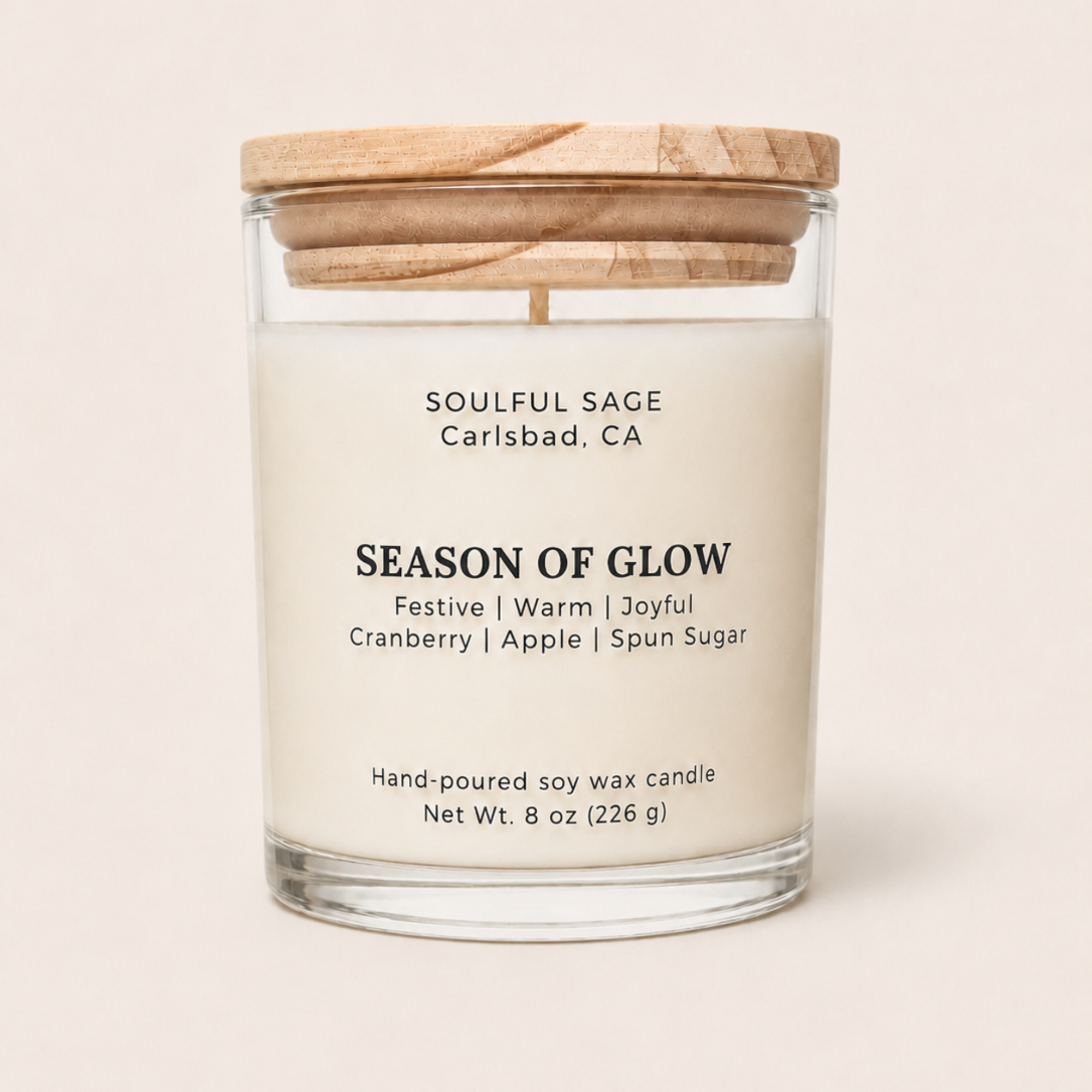 Season of Glow soy candle with festive cranberry, apple, and spun sugar fragrance notes, hand-poured by Soulful Sage