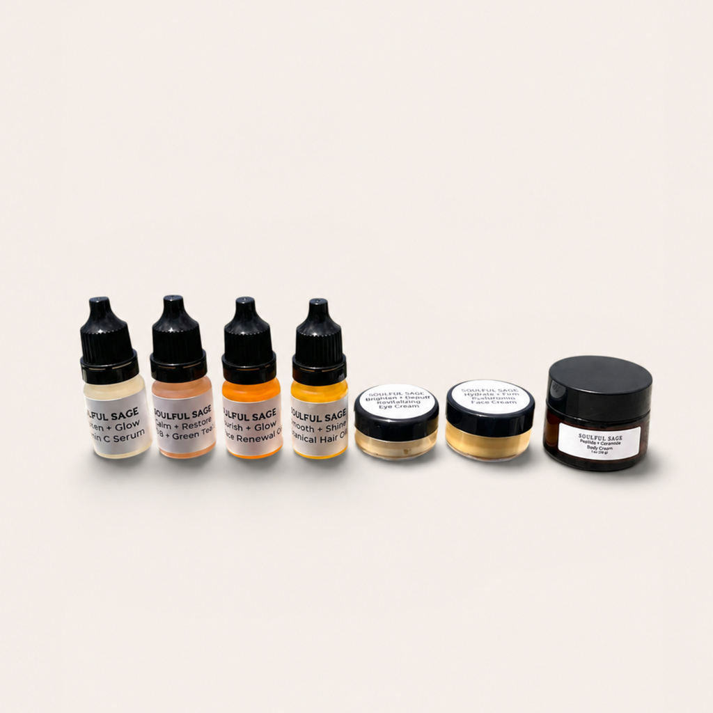 Soulful Sage travel-size skincare collection with Vitamin C serum, Vitamin B + Green Tea serum, face renewal oil, botanical hair oil, eye cream, face cream, and Peptide + Ceramide Body Cream on a neutral background